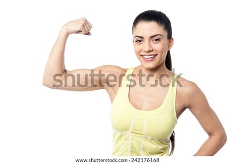 Athletic Young Woman Flexing Biceps Stock Photo Edit Now 242176168