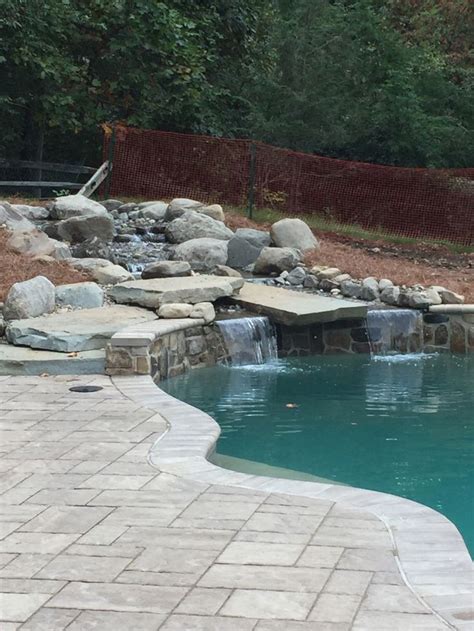 Natural Stone Waterfall Into Pool With Images Pool Outdoor Ponds