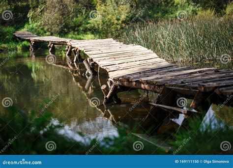 Wooden Bridge Over The River Stock Photo Image Of Flowing Adventure