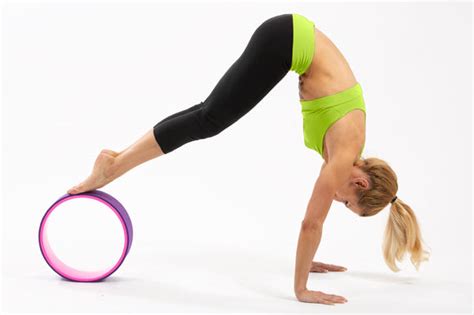 5 Yoga Wheel Exercises To Build Strength