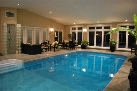 <p>home plans with indoor swimming pool. 20 Homes With Beautiful Indoor Swimming Pool Designs