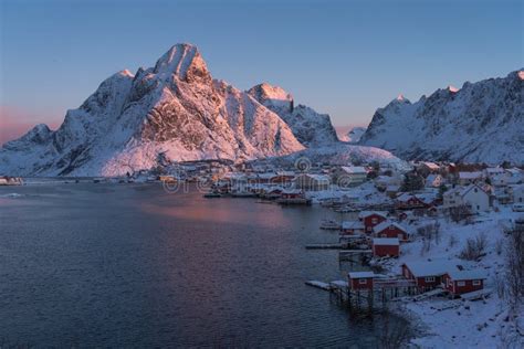 Beautiful Reine Village And Boats With Reflection In A Morning Sunrise