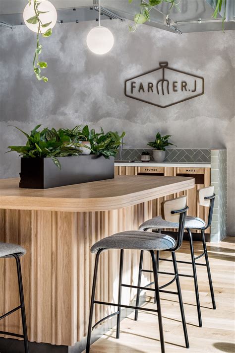 Farmer J Restaurant In London Boasts Grey Surfaces And Green Accents
