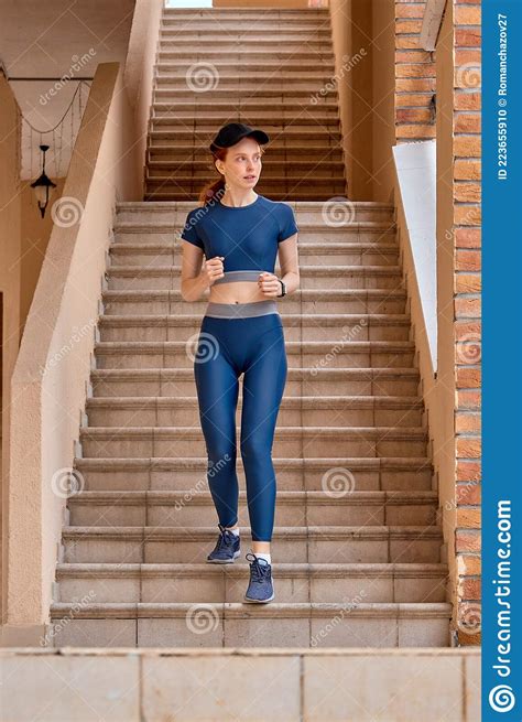 Young Caucasian Woman Exercising In Sportswear Jogging Going Up And