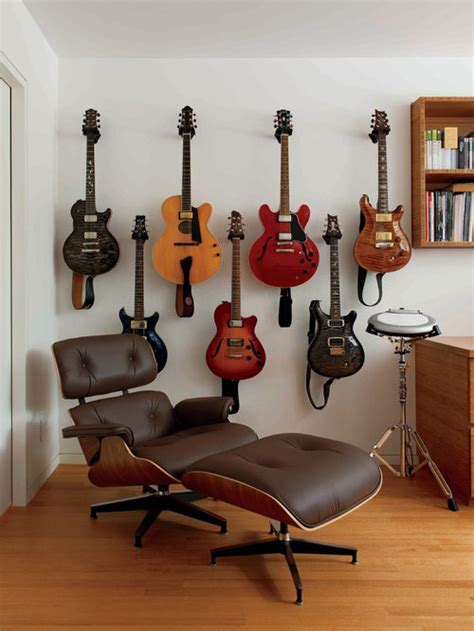 Holding the hanger in place measure the distance from the top of hanging them on the wall keeps them safe from harm and available to play all the time. Hanging Guitar Ideas, Pictures, Remodel and Decor