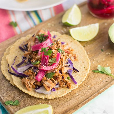 Top with sour cream, red onions, cilantro, lime juice, hot sauce and mozzarella cheese. Jackfruit Pulled Pork Tacos | Mindful Avocado