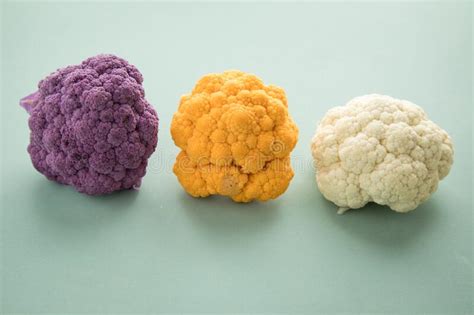 Colorful Rainbow Cauliflower In Purple Orange And White In Row On