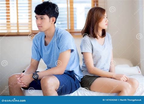 Relationship Of Young Asian Couple Having Problem On Bed In The Bedroom