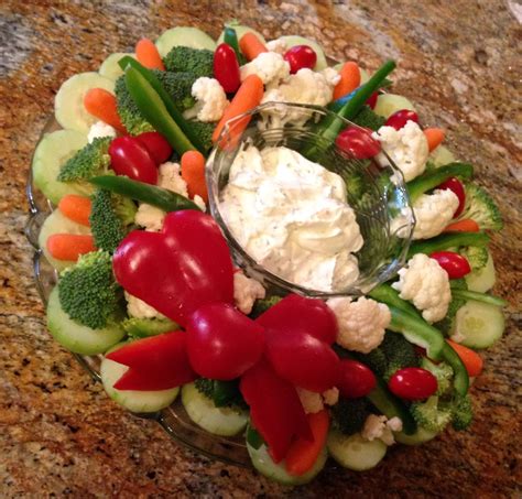 From cocktails and hors d'oeuvres to spectacular roasts and sides, these are the essentials of the holiday season. Christmas Vegetable wreath | Appetizer recipes, Christmas vegetables, Christmas recipes appetizers