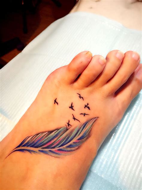 Some people believe that if a person wears a huge peacock feather tattoo, then it says about his vanity. My renewed feather and birds tattoo | Foot tattoos ...