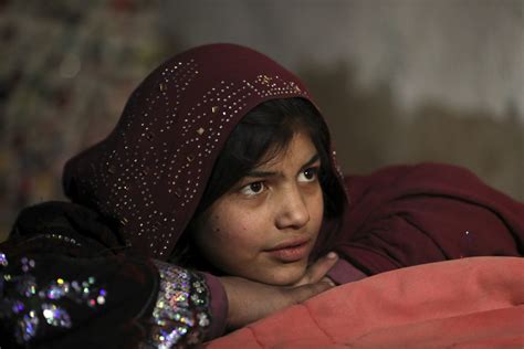 An Afghan Girl Sit At Her Home At A Camp In The City Of Kabul Afghanistan Rci English