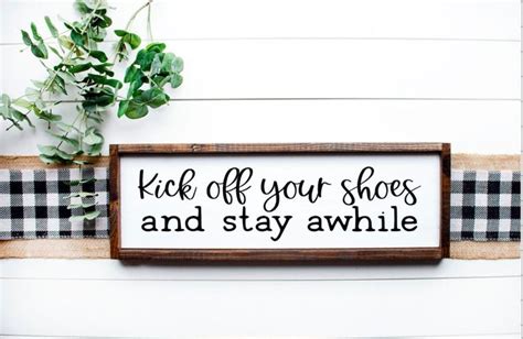 A Wooden Sign That Says Kick Off Your Shoes And Stay Awhile On The Wall