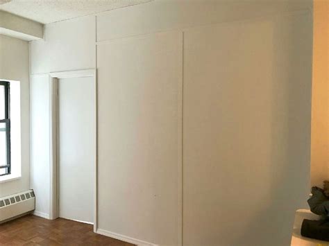 A bookcase divider doesn't always have to be ceiling tall or wide either. Floor to ceiling temporary wall with door. Call us for all ...