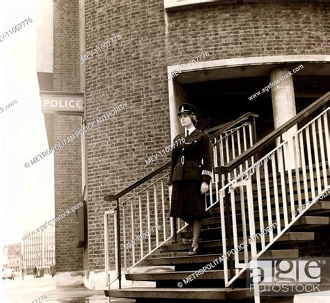 Woman Police Officer Walking Down The Front Steps Of Kennington Road