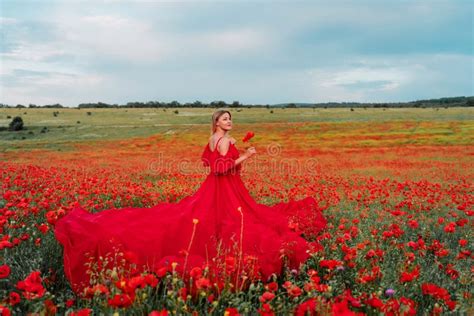 woman poppy field red dress happy woman in a long red dress in a beautiful large poppy field