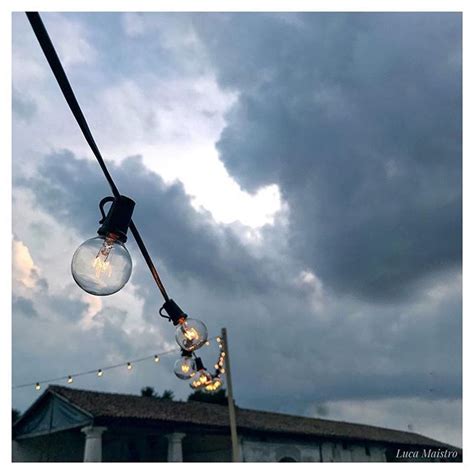 Taken with instagram, sunset with brooding clouds and a street lamp. Sunset living light #sunset #lamp #light #beautiful #photograpy #building #weekend #sunday #july ...