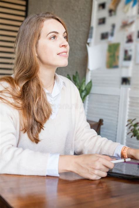 Pretty Business Woman Sitting With Laptop Gadget And Working In Office