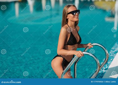 Portrait Of A Beautiful Woman Getting Out Of A Swimming Pool Beautiful Long Hair Tanned Female