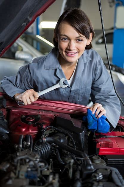 Female Mechanic Servicing Car Photo Free Download