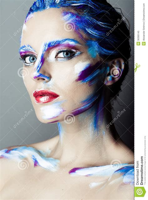 Creative Art Makeup Of A Young Girl With Blue Eyes Stock