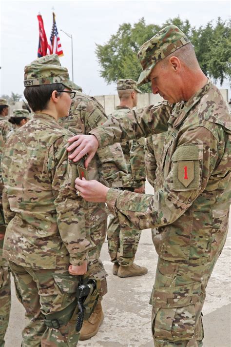 Big Red One Soldiers Don Shoulder Sleeve Insignias In Patching
