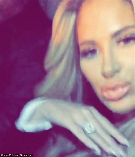 Kim Zolciak Records Snapchat Video In Moving Car To Shows Off Her Huge