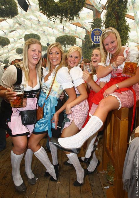 A Group Of Women Dressed Up In Costume Posing For A Photo At A Beer Festival