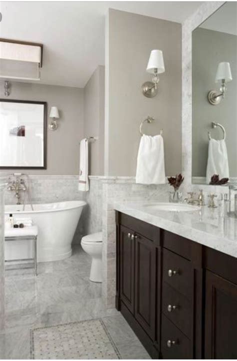 Learn how to change the color of the grout to make it darker or lighter, and revive your tilework. Another example of a dark vanity in a white & grey ...