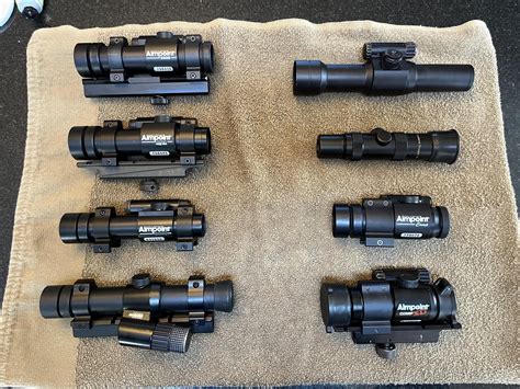 My 1990s, early 2000s Aimpoint collection, complete with vintage AR15