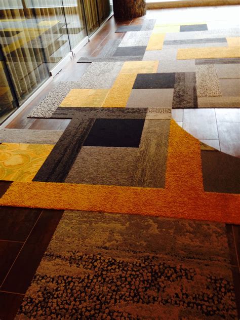 Interface Carpet Tile Pattern At The Entry Of Their Showroom