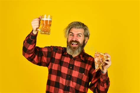 Guy In Bar Drinking Beer And Eating Pizza Cheers Glass Of Beer And Pizza Watching Football On