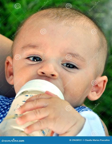 Baby Drinking From Bottle Stock Image Image Of Cuddling 29638931