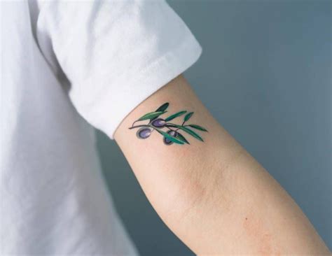 Olive Branch Tattoo On The Left Bicep Olive Tree Tattoos Olive Tattoo