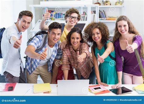 Happy Students Working Together On Laptop Stock Photo Image Of Campus