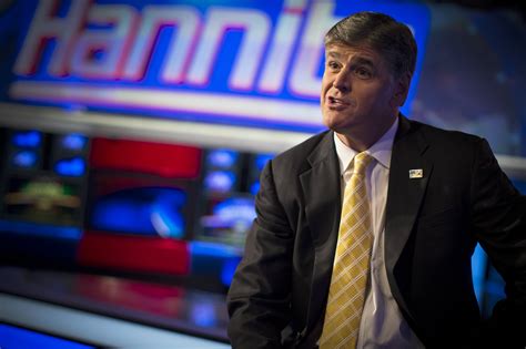 Fox News Channel Anchor Sean Hannity Poses For Photographs As He Sits