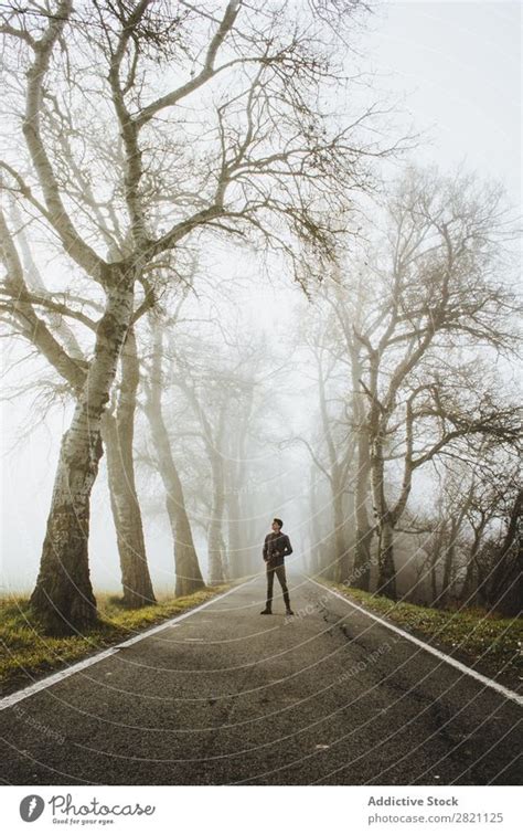Man Standing On Foggy Road A Royalty Free Stock Photo From Photocase