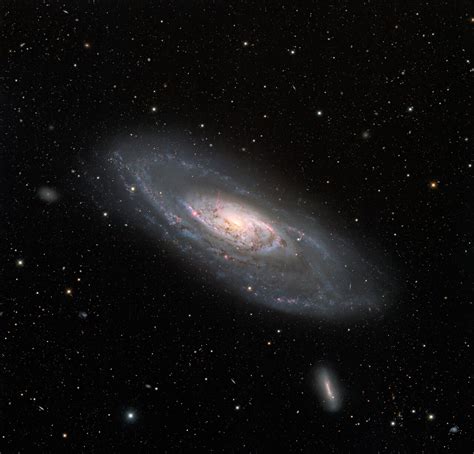 Wide View Of Spiral Galaxy Messier 106 Noirlab
