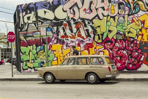Classic Car Park In Wynwood District Background Graffiti Painted Wall