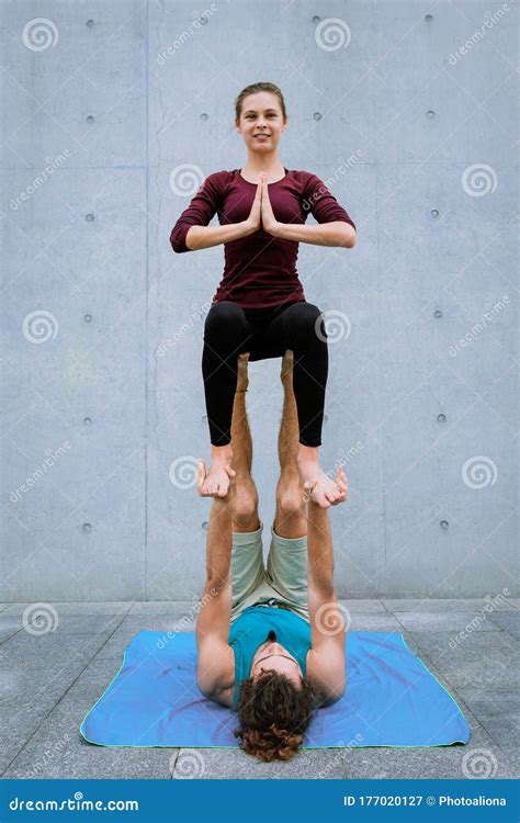 Couple Practicing Acro Yoga Outdoors Acroyoga Concept Throne Pose