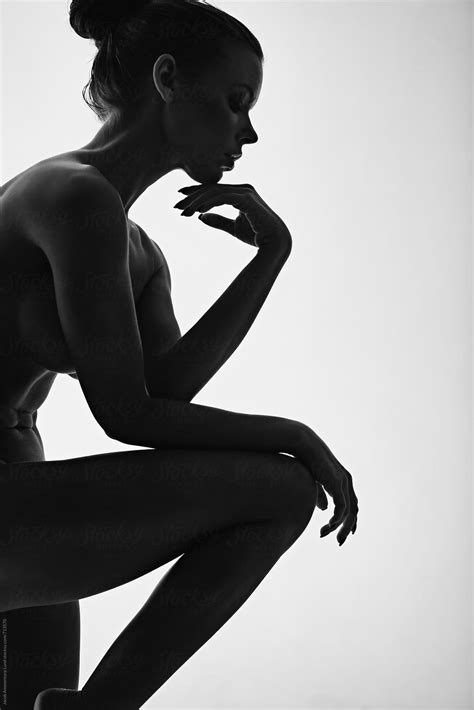 Beautiful Silhouette Of Nude Woman Thinking With Her Hand On Chin By