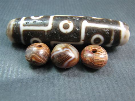 3 Chung Dzi Beads And A Large 9 Eye Agate Dzi Bead Himalayan Regions