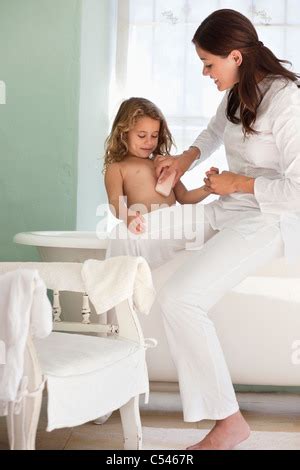 Woman Giving A Bath To Her Daughter Stock Photo Alamy