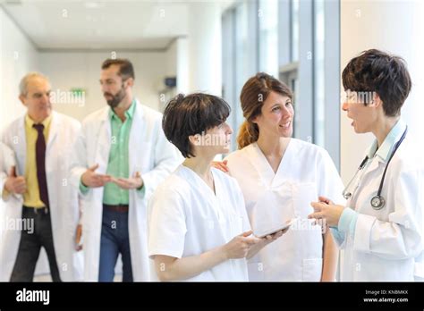 Doctors And Nurses Talking In Corridor Hospital Stock Photo Alamy