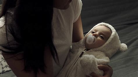 Mother Calming Her Baby Daughter By Stocksy Contributor Aleksandar Novoselski Stocksy