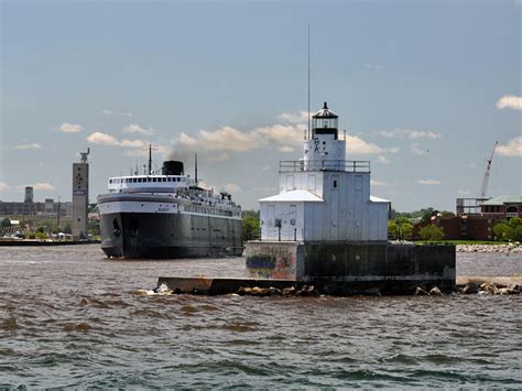 The keeper of the lake. The BADGER heading past the Manitowoc breakwater light on its eastbound journey to Ludington ...