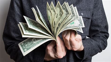 Fantastic massage to your beloved guy with a surprise. Holding money in hands | Photo by CafeCredit under CC 2.0 ...