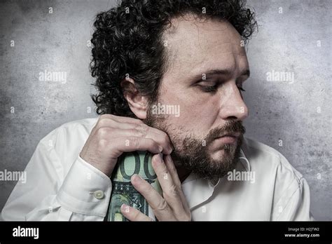 Man pinching penny hi-res stock photography and images - Alamy