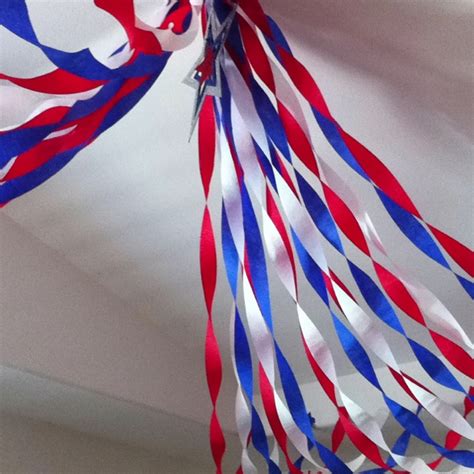 Red White And Blue Streamers Hanging From The Ceiling