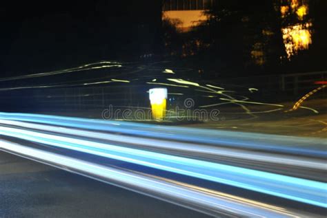 Long Exposure Shot Of A Car On A Road At Night Stock Photo Image Of