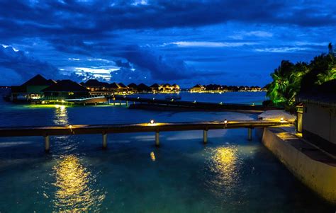 Panoramic View Of The Water Bungalows At Night Vadoo Resort Maldives